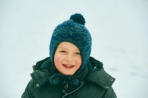 Closeup portrait of happy child in winter hat — Stock Photo, Image