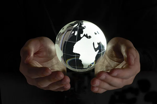 Crystal globe a kezében — Stock Fotó