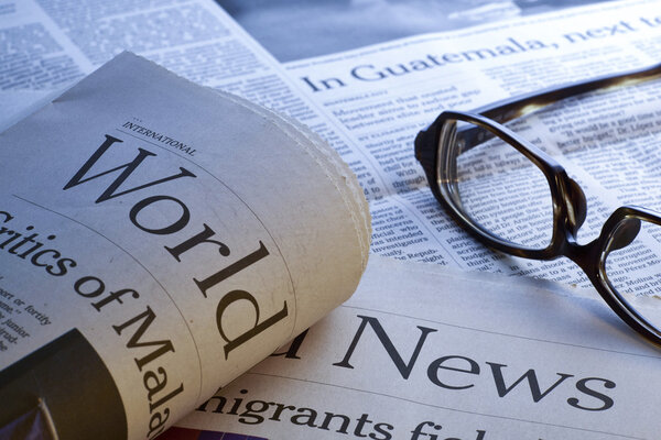 Glasses on newspaper
