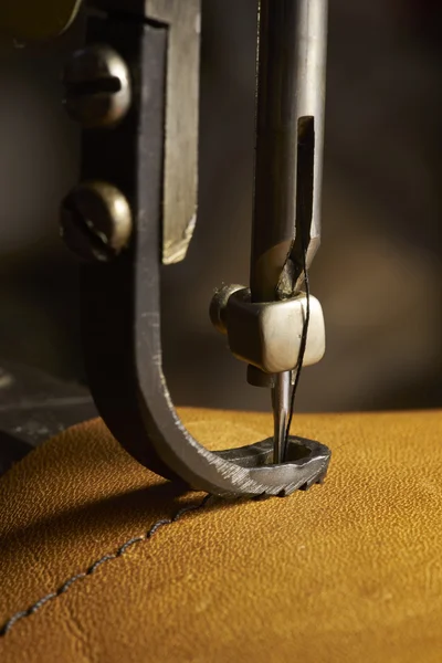 Closeup of sewing machine working part with leather — Stock Photo, Image