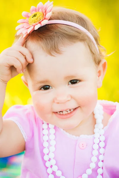 Close up portrait of charming smiley face of one year old