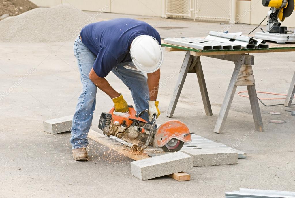 Worker Cutting Metal Studs Stock Photo by ©Lawcain 66440197
