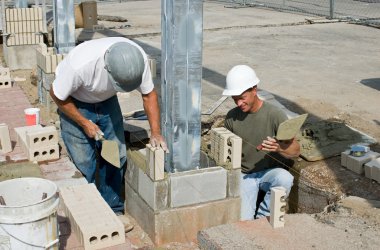 Bricklayers Installing Soldiers clipart