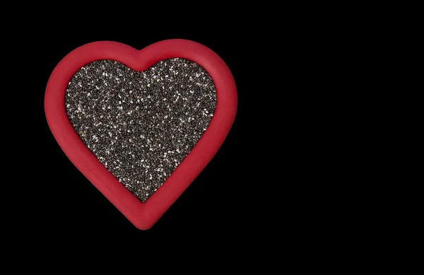 Corazón sano semillas de chía en negro — Foto de Stock