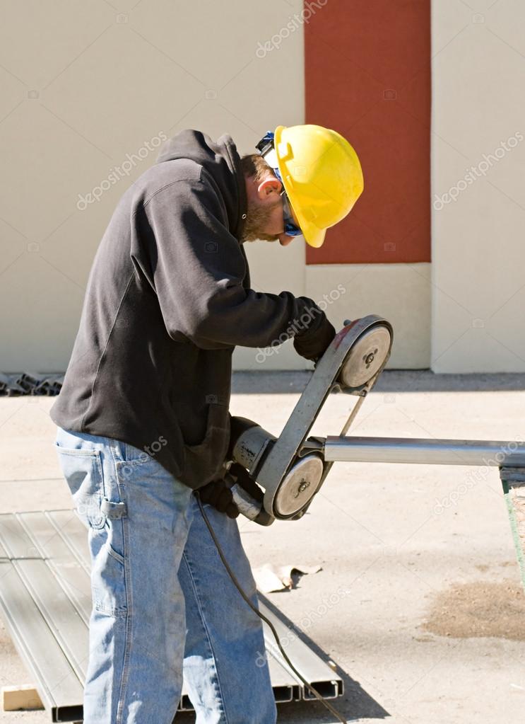 Worker Using Porta-Band Saw