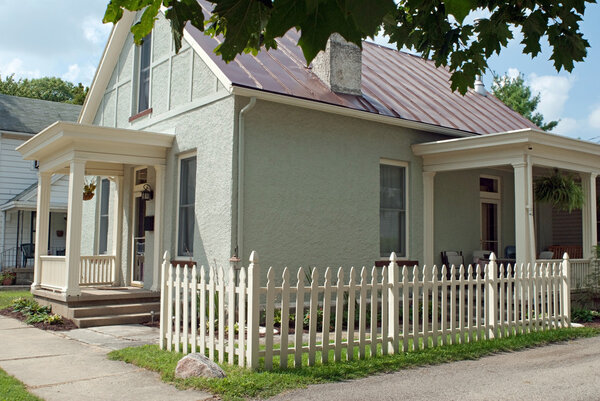 Corner Picket Fence with Small Stucco Cottage