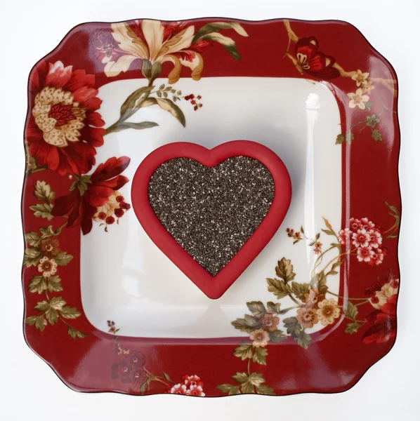 Placa floral con corazón de semilla de chía — Foto de Stock