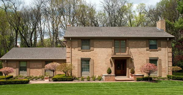 Large Brick Home with Flowering Crabapple Trees — Stock Photo, Image