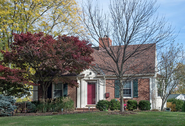 Brick Cottage with Red Maple Tree