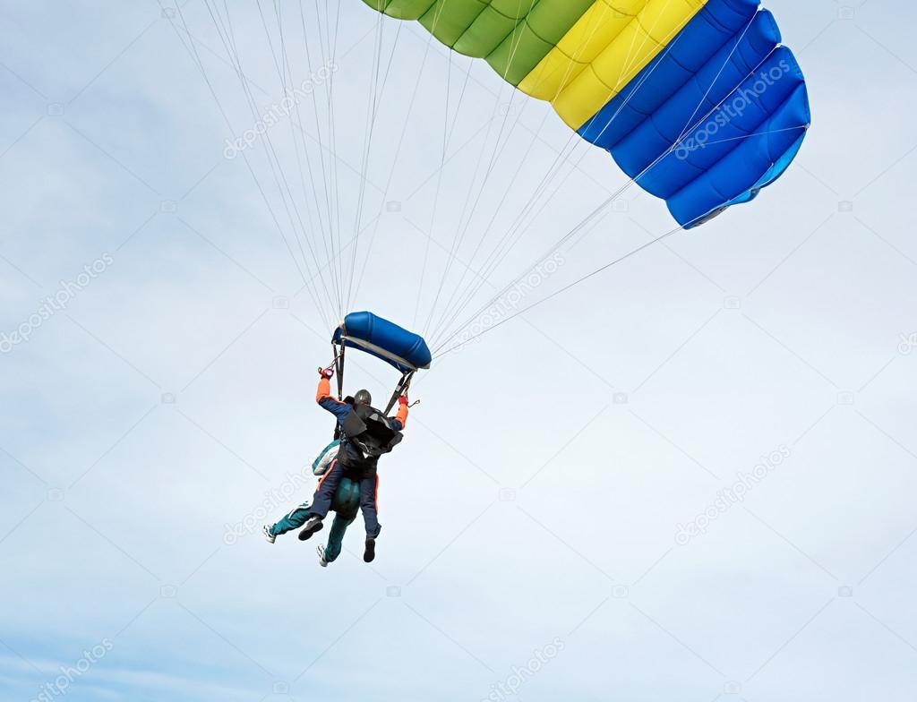 Tandem Skydiving with colorful parachute.