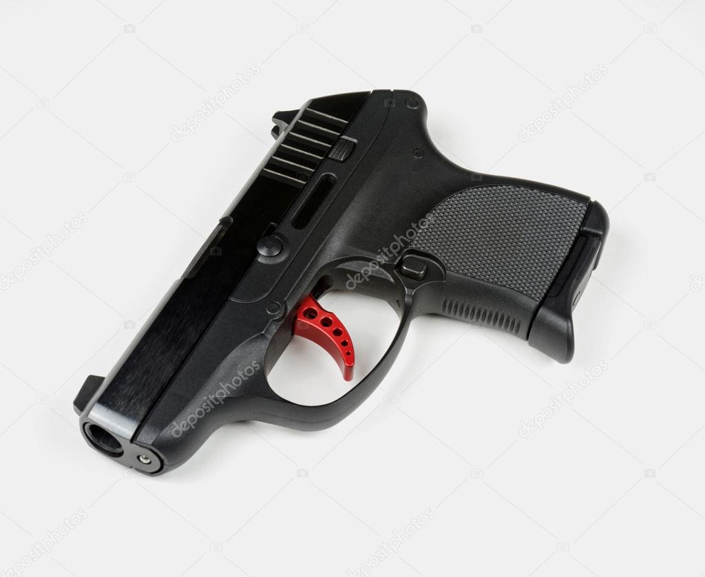 Small Handgun with Red Trigger