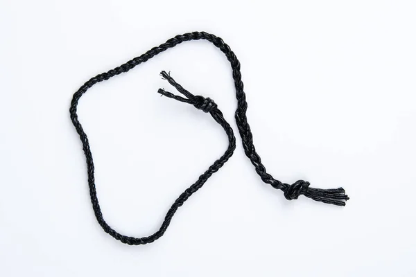 Black Leather Braided Cord Knots Ends Photographed White Surface — Stock Photo, Image