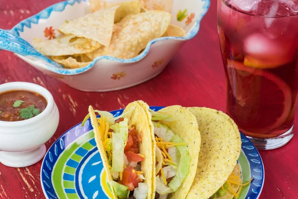 Mexican fiesta table.Tacos with beef and vegetables, plate with chips. — Stock Photo, Image