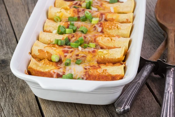 Casserole dish with mexican food - beef enchiladas. — Stock Photo, Image
