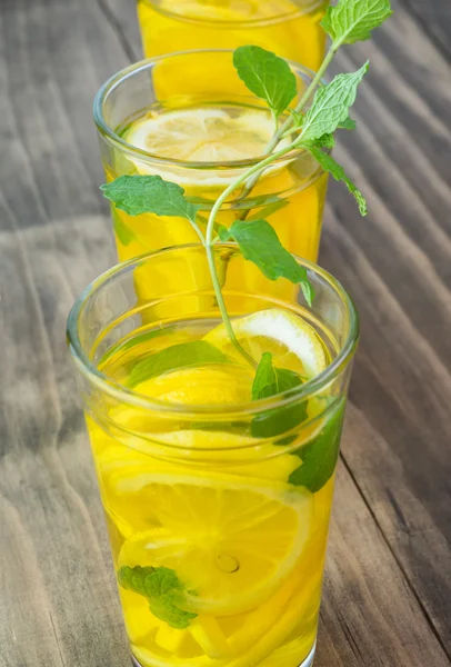 Ginger, lemon, mint infused turmeric water. — Stock Photo, Image