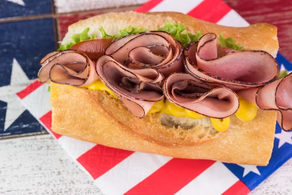 Fresh, homemade ham sandwich on party table for Forth of July ce — Stock Photo, Image