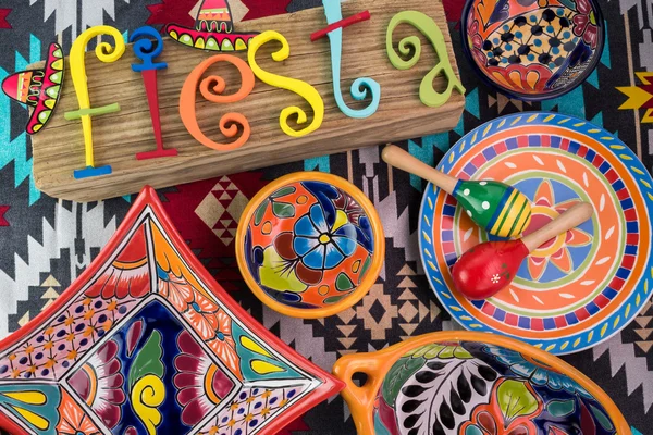 Mexican fiesta table decoration with  colorful painted letters, sombrero, bright pottery. — Stock Photo, Image