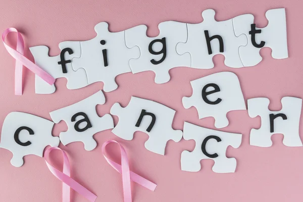 Copmlete puzzle with fight cancer inspirational quote about brea