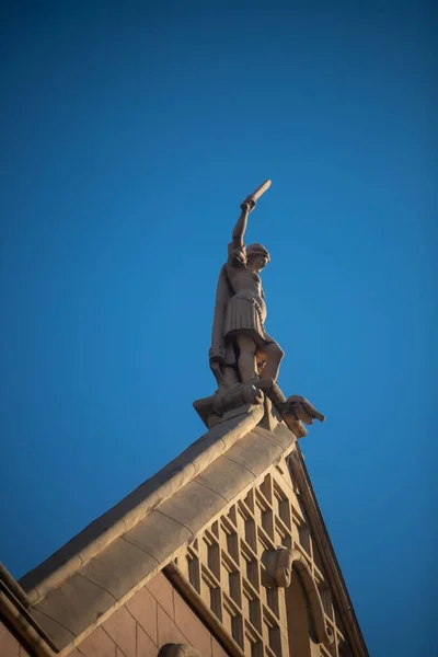 statue of a man on the roof