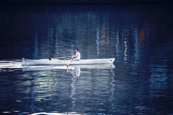 stock image a man on a boat in the water