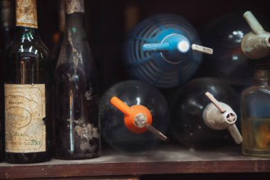 old vintage soda bottles with a lot of different sizes