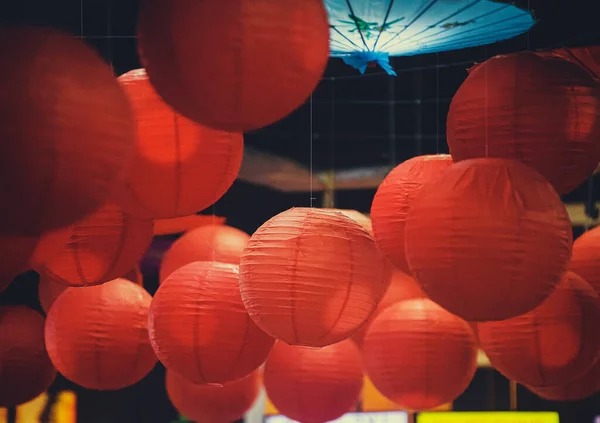 japanese lanterns hanging on the street