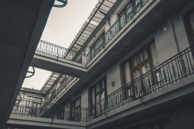 Looking up at building balconies