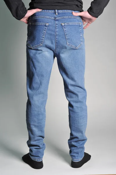 Youth jeans put on the guy — Stock Photo, Image