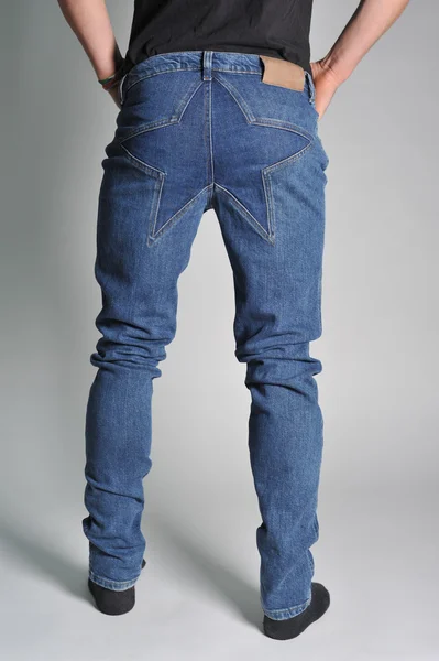 Youth jeans put on the guy — Stock Photo, Image