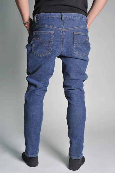 Youth jeans put on the guy — Stock Photo, Image