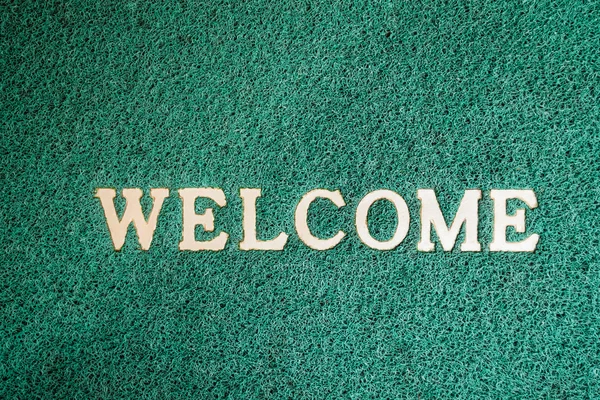 Close up door mat with welcome word