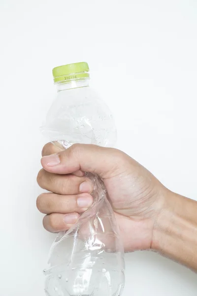 Male hand squeeze plastic bottle — Stock Photo, Image