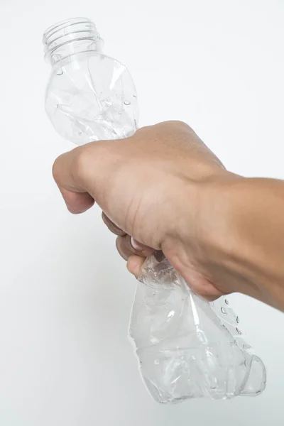 Male hand squeeze plastic bottle — Stock Photo, Image