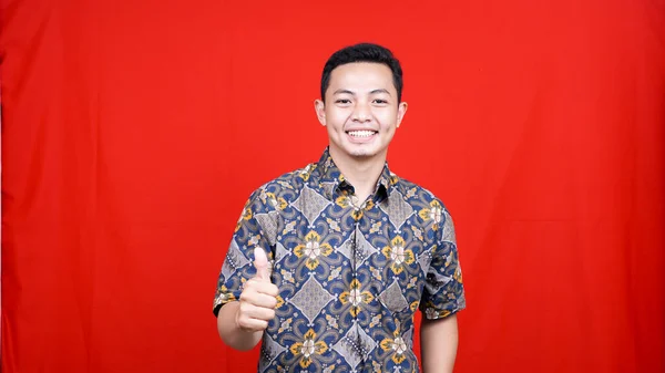 Asian Man Expression Batik Clothes Studio Isolated Red Background — Stock Photo, Image
