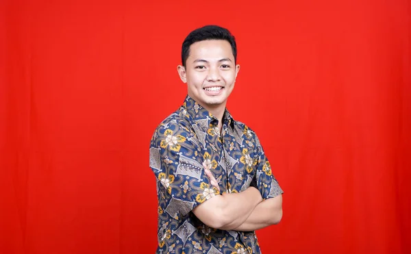 Asian Man Stylish Batik Clothes Studio Isolated Red Background — Stock Photo, Image