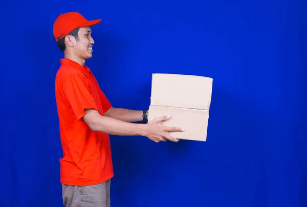 Delivery Man delivery box to customer isolated blue background