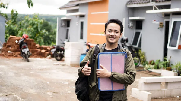 Portrait Young Men Standing Front New House Holding File Gesture — Stock Photo, Image