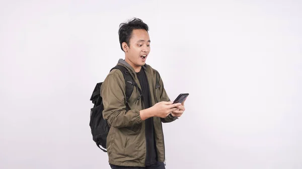 Young Man Wearing Isolated Bag White Background Holding Phone — Stock Photo, Image