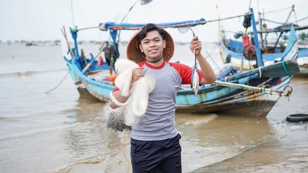 Happy Young Fisherman Beach Holding His Catch Fish Shows Front — Stock Photo, Image