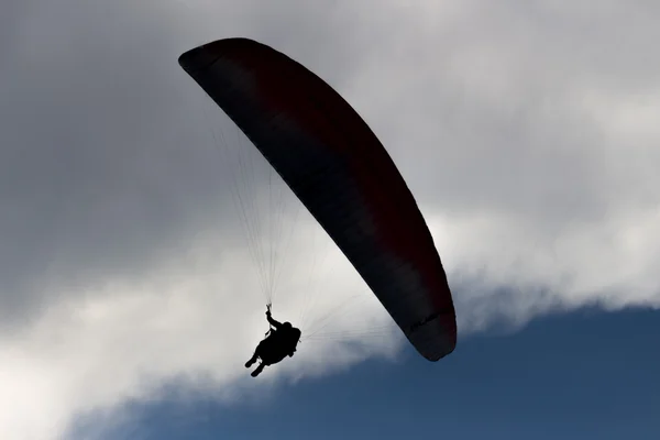 Blue sky, parachute and human silhouette. adventure — Stock Photo, Image