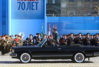 MOSCOW,07 MAY,2015: Russian defense Minister, Army General Sergei Shoigu rides in a limo at the Red Square in Moscow during the final rehearsal of the military parade to mark the Victory day clipart
