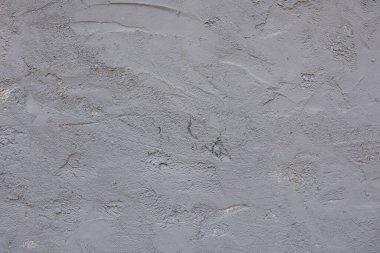 Büyük gri beton duvar, yaşla yıpranmış. Arkaplan.