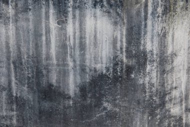 Büyük gri beton duvar, yaşla yıpranmış. Arkaplan.