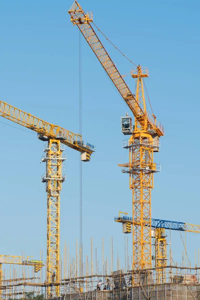 Construction site background. Crane and building under construction