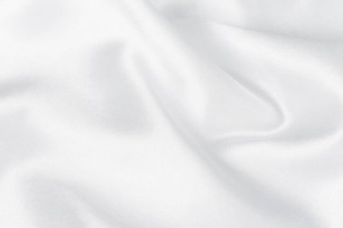 Soyut beyaz ipek kumaş dokusu arkaplanı. Kumaş yumuşak dalga. Saten hazineleri.
