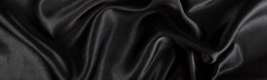 Soyut siyah ipek kumaş dokusu arkaplanı. Kumaş yumuşak dalga. Saten hazineleri.