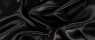 Soyut siyah ipek kumaş dokusu arkaplanı. Kumaş yumuşak dalga. Saten hazineleri.