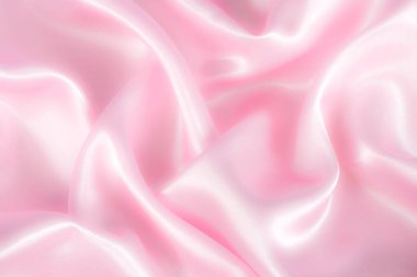 Soyut pembe ipek kumaş dokusu arka planı. Kumaş yumuşak dalga. Saten hazineleri.