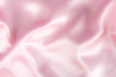 Soyut pembe ipek kumaş dokusu arka planı. Kumaş yumuşak dalga. Saten hazineleri.