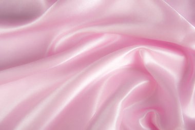 Soyut pembe ipek kumaş dokusu arka planı. Kumaş yumuşak dalga. Saten hazineleri.